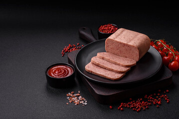 Delicious canned pink ham with salt, spices and herbs