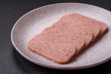 Delicious canned pink ham with salt, spices and herbs