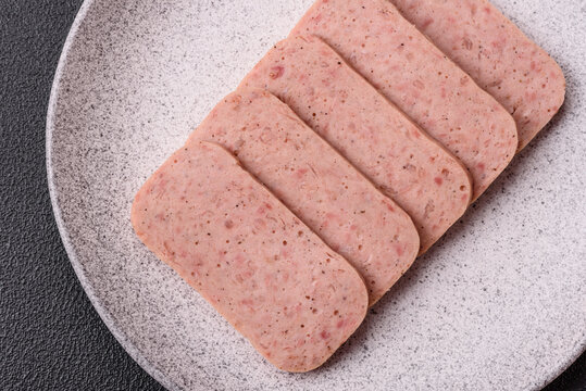 Delicious canned pink ham with salt, spices and herbs