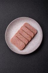 Delicious canned pink ham with salt, spices and herbs