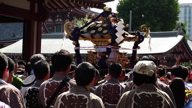 ASAKUSA, TOKYO, JAPAN - 18 MAY 2024 : Scenery of SANJA MATSURI (SANJA FESTIVAL) in Asakusa city. Japanese summer festival concept video. Slow motion shot.
