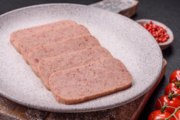 Delicious canned pink ham with salt, spices and herbs