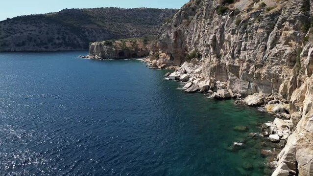 Aerial view of the cliffs beneath the monastery on Thasos, Greece over the Aegean sea