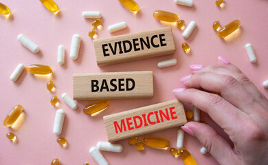 Evidence Based Medicine symbol. Concept word Evidence Based Medicine on wooden blocks. Doctor...