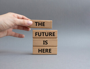 The future is here symbol. Concept words The future is here on wooden blocks. Beautiful grey...