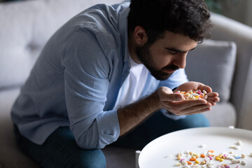 Man taking medicine. 