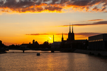 Fototapeta premium Wroclaw, Poland sunset. Odra River and Ostrow Tumski island with its historic buildings.