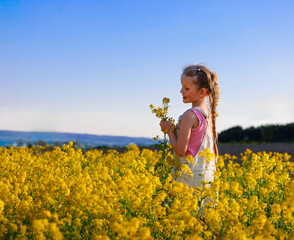 Solitary girl in a field of flowers