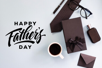 Flat lay with men's accessories and happy father's day greeting lettering text	