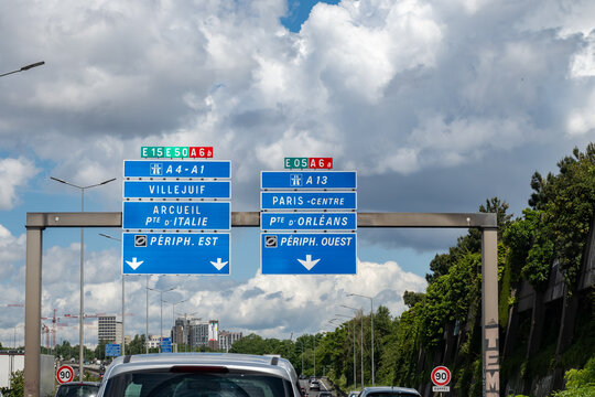 Highway road signs Paris, driving in heavy traffic on ring road of capital of France, traffic jam problems in Paris