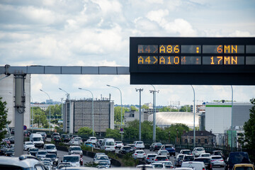 Driving in heavy traffic on ring road of capital of France, traffic jam problems in Paris
