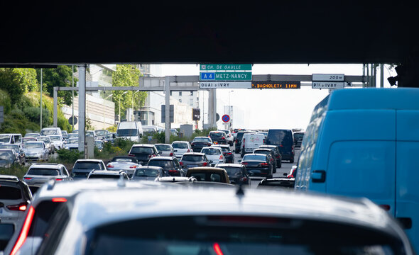 Driving in heavy traffic on ring road of capital of France, traffic jam problems in Paris