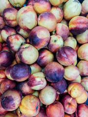 lots of ripe fruit nectarin peaches for food as background