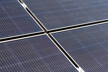 Close-up photo of the surface of solar panels in a solar power plant.