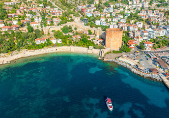 An aerial view of the Tersane beach bay Alanya in Antalya Turkey. Sea and city with an open sky. Kizil Kule - Alanya