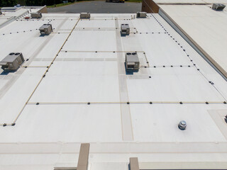 Drone Images of Commercial Roofs Featuring TPO and Asphalt Shingles: Midday, Sunny, No People