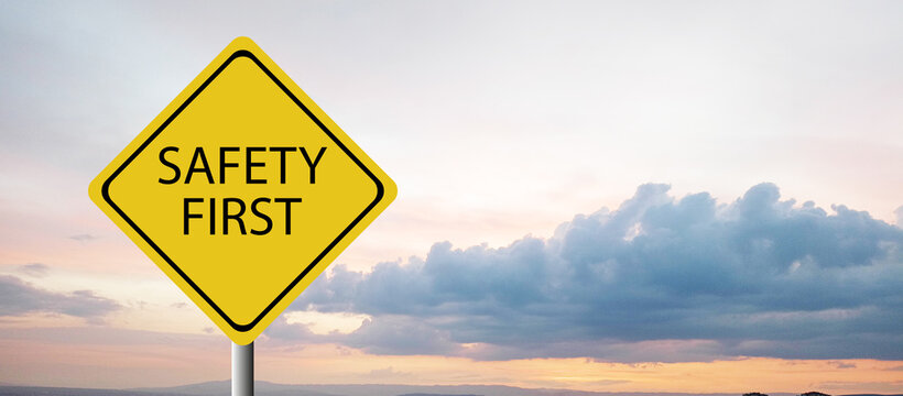 Safety first symbols, work safety, caution work hazards, danger surveillance, zero accident concept. Wooden cubes with smart grey background. Employees safety awareness at workplace. Safety banner.