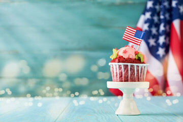 Patriotic cupcake 4th july with american flag. Delicious cupcake with cream cheese, blue, red star...
