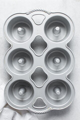 overhead view of bundtlette pan, flatlay of six cavity mini bundt pan, top view of cast iron baking pan