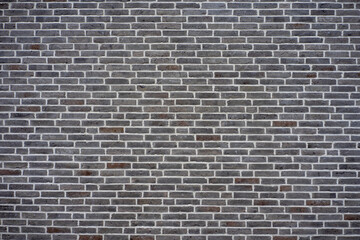 Gray brick wall texture perfect for backgrounds or copy space in design projects.
