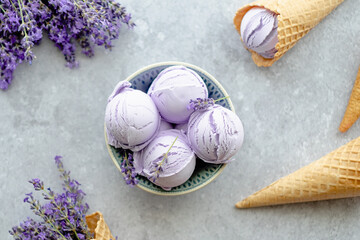 Creamy balls vegan lavender ice cream in plate with flowers french lavender. flat lay, top view.