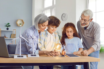 Curious grandparents, with grandchildren, explore solar panels and alternative energy sources at home. Family bonding activity involves learning about sustainable energy technology.