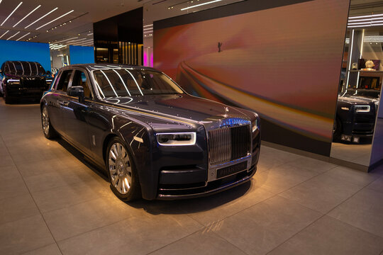 British black luxury limousine Rolls-Royce Phantom VIII with four-wheel steering, manufactured Rolls-Royce Motor Cars automobile manufacturer auto salon, Sales Office in London - May 22, 2024