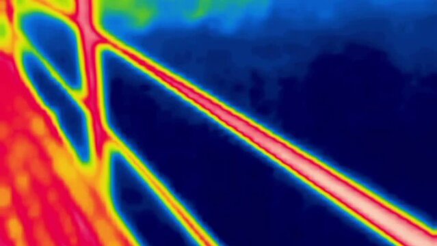 A walk on a air bridge (suspension bridge) over a small river. Image from thermal imager device.