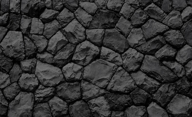 Empty black embossed stone wall for abstract background and texture for interior or exterior design. Beautiful patterns, space for work, banner, wallpaper close up.