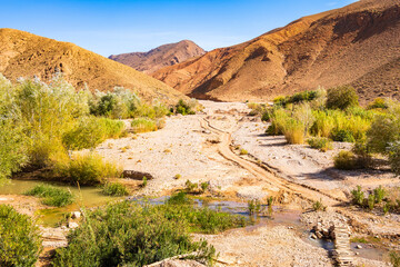 Path across river in desert mountain landscape of Dades valley, Morocco, North Africa