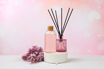 Spa and wellness composition, Fragrant rose water, lilac incense sticks and lilac flowers. salon...