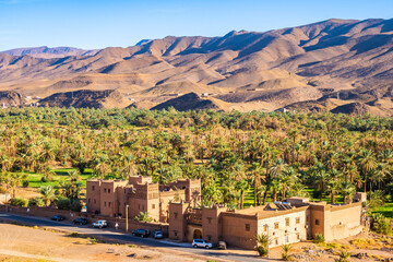 View of traditional riad kasbah building with beautiful Arabic architecture in Tamnougalt, Morocco,...