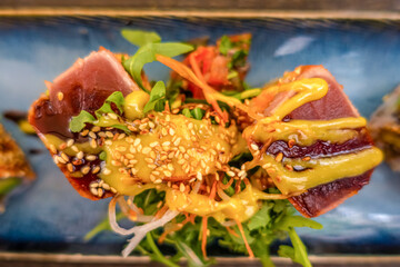 Overhead view of platter of sushi rolls