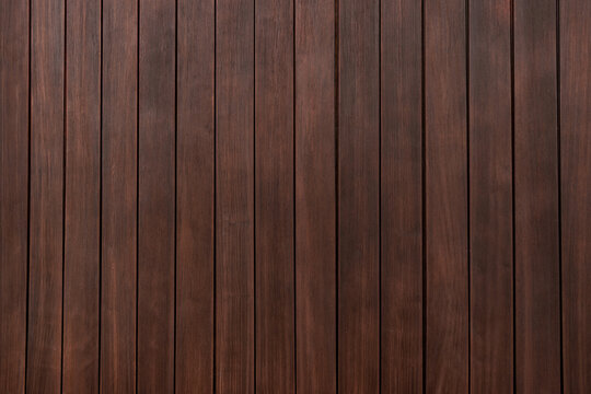 Dark wood texture with slats arranged vertically