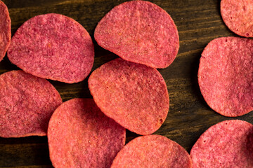 adding red dye to potato chips