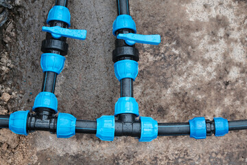 Fragment of a water supply system made of HDPE pipes, installation of automatic watering