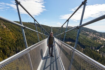 Skybridge 721 suspension footbridge, man walking through