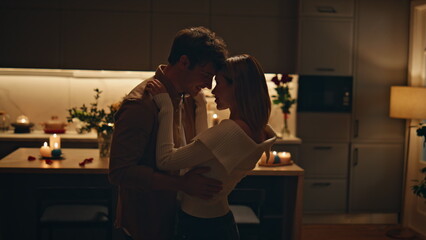 Passionate couple dancing home kitchen close up. Happy lovers moving slowly 