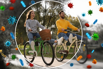 Couple with strong immunity riding bicycles outdoors. Bubble around them blocking viruses,...