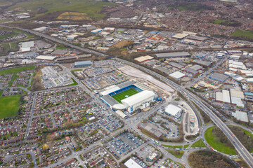 Aerial photo of the famous Elland Road football stadium in Leeds, West Yorkshire, England, which is home of Leeds United Football Club, showing fans attending a soccer match