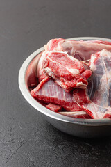 Uncooked beef ribs in bowl