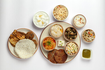 Top-view of Veg Indian food thali. Isolated on a white background. 