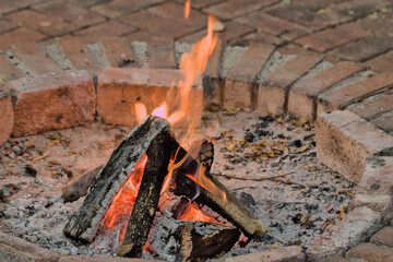 burning firewood in a fire pit