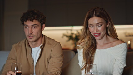 Romantic pair relaxing evening date holding wine glasses closeup. Couple talking