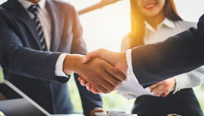 businessmen shaking hands in agreement, symbolizing successful partnership and teamwork