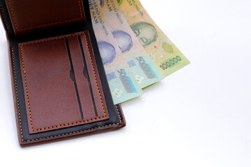 Vietnamese dong banknotes on yellow background.