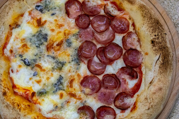 Traditional Brazilian style pizza, half flavored with four cheeses and half pepperoni on long-matured artisanal dough