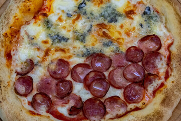 Traditional Brazilian style pizza, half flavored with four cheeses and half pepperoni on long-matured artisanal dough