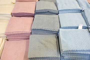 A stack of blue and pink towels