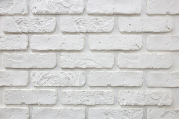 A white brick wall with white brick pattern